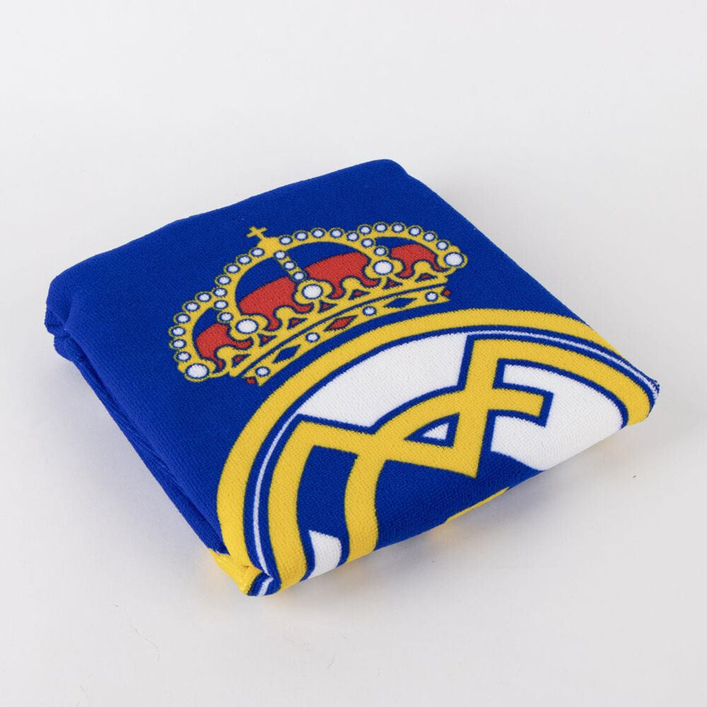 Real Madrid C.F., πόντσο πετσέτα μπλε διπλωμένο με έμβλημα και κορώνα